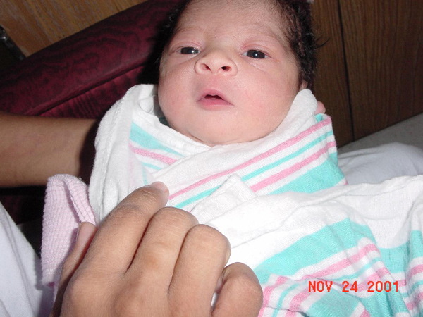 Amira with eyes open, 1 day old!